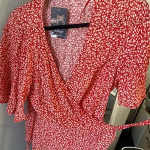 Red blouse with white flowers